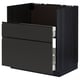 Modern black kitchen cabinet with sleek drawers and handle-free doors.