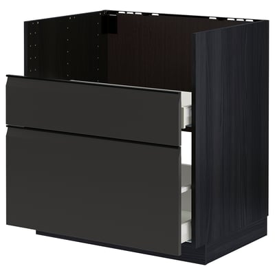 Modern black kitchen cabinet with sleek drawers and handle-free doors.