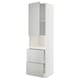 A white METOD kitchen unit with light grey drawers and cabinets, combining modern design with practical storage.