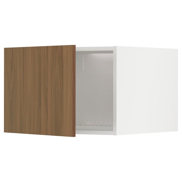 A modern white METOD kitchen cabinet with a sleek walnut door, showcasing a minimalist design.