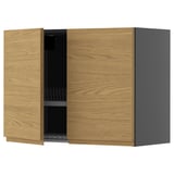 A wooden kitchen cabinet with a gray side. It has oak-style doors and built-in handles, providing a minimalist look with a warm feel.