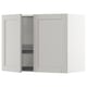 White kitchen wall cabinet, open door revealing shelf with wire dish drainer, angular modern design.