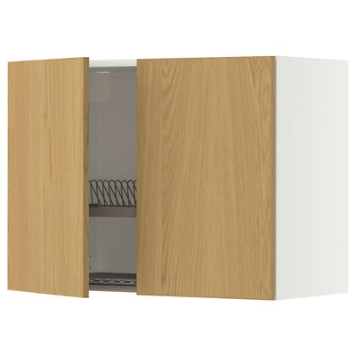 Wooden kitchen cabinet with open door, showing dish drainer inside.