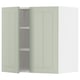 A light green METOD kitchen cabinet with two doors and adjustable shelves, set against a white background.