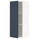 A METOD kitchen cabinet with an open blue door, featuring a modern traditional design in dark blue and white.