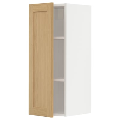 A white METOD kitchen cabinet with a light oak door, featuring a simple, rectangular design and beveled edges.