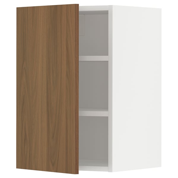 A modern kitchen cabinet named METOD with a walnut-colored door and white frame, featuring clean lines and minimalist design.