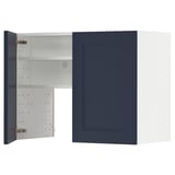 Blue METOD kitchen cabinet with white interior, open door, adjustable shelf.