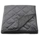 Dark grey MJUKPLISTER recycled velvet bedspread, soft and quilted.