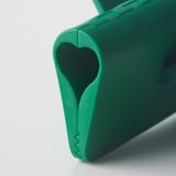 Bright green plastic clamp with heart-shaped cutout, durable design, perfect for sealing bags.