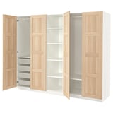 An ikea PAX wardrobe with light oak doors. It adjustable shelving and compartments, including mesh drawers for folded clothes.