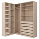 This image shows a light wooden corner wardrobe named PAX with shelves and drawers.