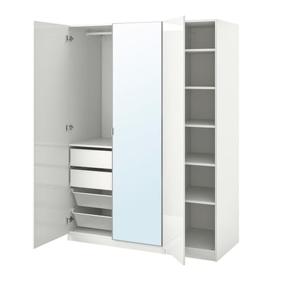 White PAX wardrobe with mirror, shelves, and drawers. Modern storage solution.