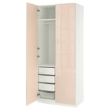 An open PAX wardrobe in light beige with storage compartments and a hanging rod.