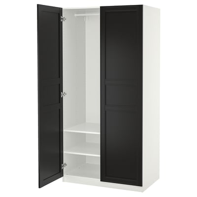 A white PAX wardrobe with black doors, standing vertically. It two open sections with shelves inside.