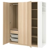 This image shows a light oak PAX wardrobe with open doors, showcasing multiple shelves and organizers for efficient storage.