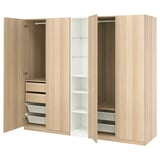 PAX wardrobe in light oak, three sections open displaying drawers, shelves, and hanging space with soft-closing hinges.