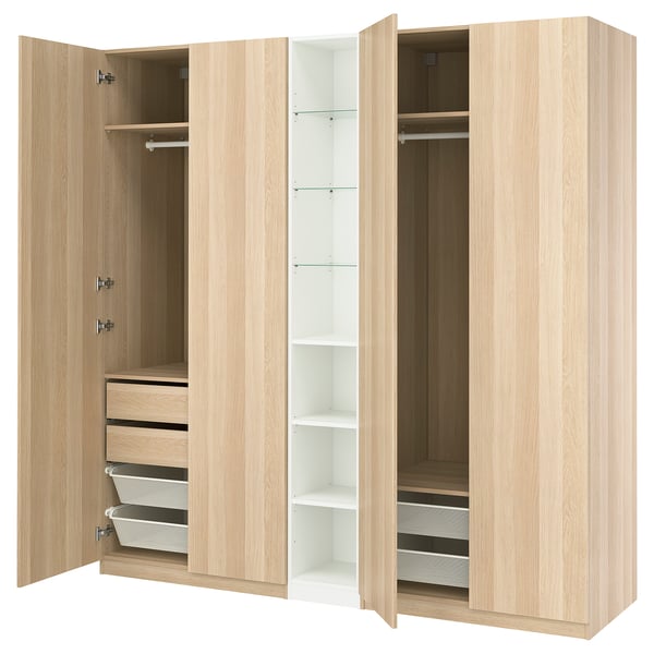 PAX wardrobe in light oak, featuring open and closed storage, hanging rails, shelves, and drawers, designed for organized space management.