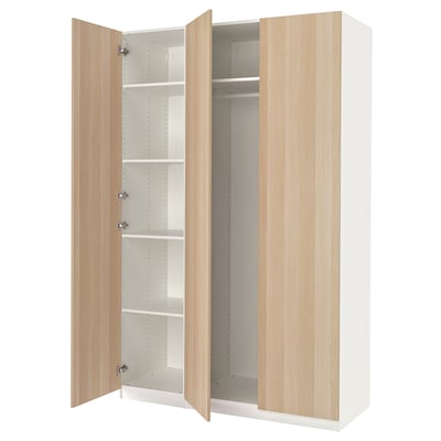 An open white and light wood PAX wardrobe with multiple shelves inside.