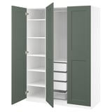 Green ikea PAX wardrobe open, showing shelves and storage.