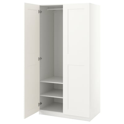 White wardrobe PAX; slim minimalist design; two doors, empty shelves, and hanging rod.