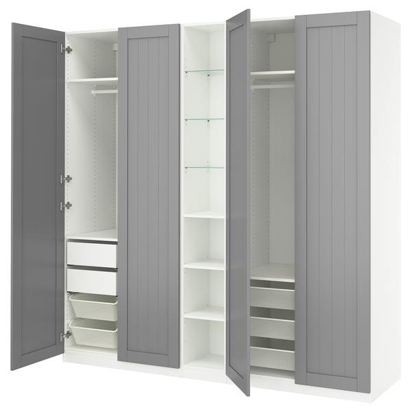 A gray, open PAX wardrobe with various storage options including shelves, drawers, and mesh baskets.