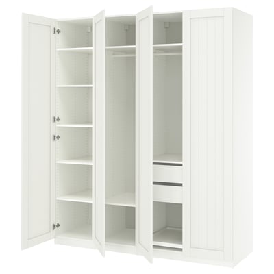White, three-sectioned PAX wardrobe with open doors, showcasing shelves and compartments.