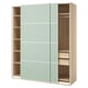 Ikea PAX wardrobe: light gray sliding doors, light wood interior shelves, spacious and modern design.