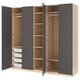 An open PAX wardrobe with gray and light wood tones, showcasing shelves and storage baskets.