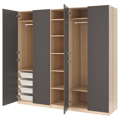 An open PAX wardrobe with gray and light wood tones, showcasing shelves and storage baskets.