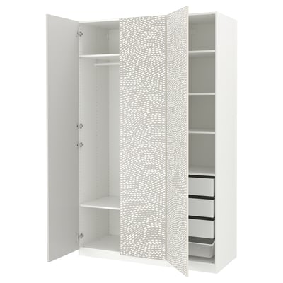 An open white ikea PAX wardrobe with shelves and drawers. The door has a dotted pattern.