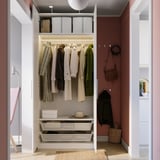 Wardrobe with clothes, drawers, shelves, lighting, and hooks.