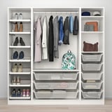A well-organized wardrobe with shoe shelves, hanging clothes, and storage bins in an adjustable, modular system.