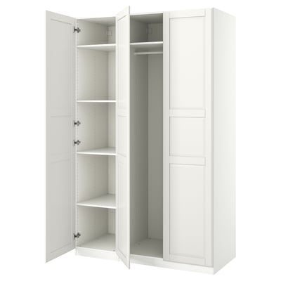An open white ikea PAX wardrobe with shelves and a clothes rod.