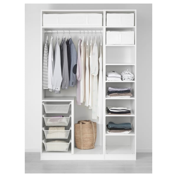 White PAX wardrobe with organized shirts, folded clothes, and baskets.