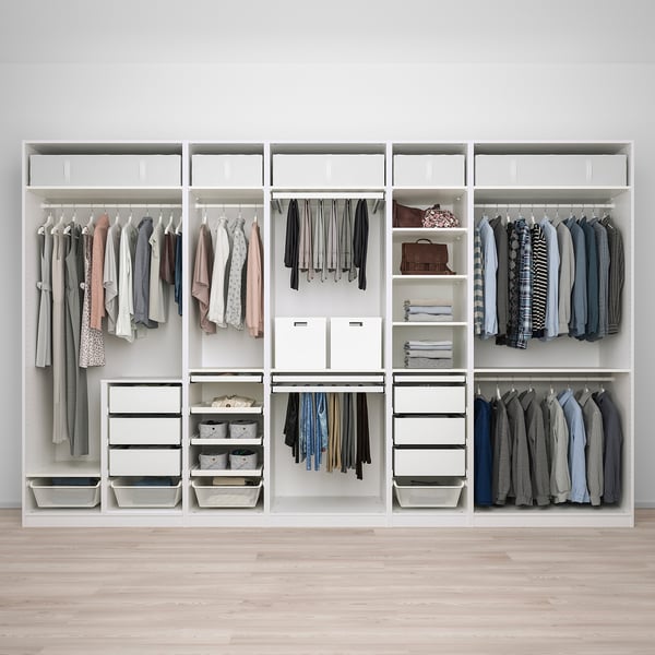Organized walk-in closet with hanging, drawers, shelves, and storage.