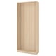 An ikea PAX wardrobe frame in light oak. Its tall, rectangular, and made of particleboard with a light wooden finish.