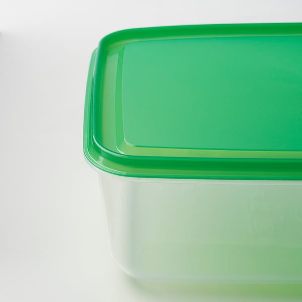 A stackable, transparent container with a green lid, likely made of durable polypropylene plastic, ideal for food storage and organization.