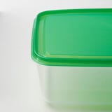 A stackable, transparent container with a green lid, likely made of durable polypropylene plastic, ideal for food storage and organization.