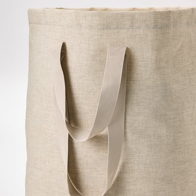 PURRPINGLA beige laundry tote bag with handles and drawstring.