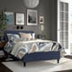 Modern bedroom with RÅHOLMAR blue bed, abstract pattern, art, mirror, lamp, plant, comfortable headboard, rug, bedside table, tv, books.
