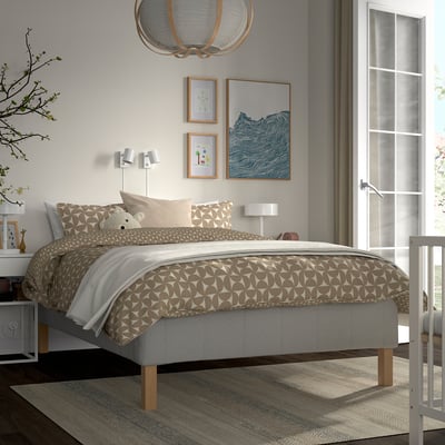 Bedroom with RÅHOLMAR bed, linens, teddy bear, nightstands, lamps, art, window.