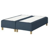 A RÅHOLMAR bed base in blue fabric with wooden legs, designed to support a mattress for comfort and spine alignment.