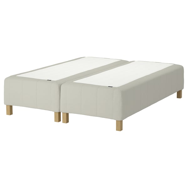 RÅHOLMAR bed base, light beige, wooden legs, upholstered, divided into 3 sections.