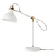 A white RANARP lamp with a round base, adjustable arm, and gold accents. The design is vintage-inspired with a steel joint and striped cord.