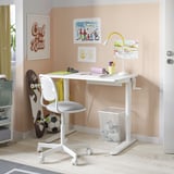 A white adjustable desk with a chair, lamp, and decorations.