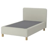 Image shows a cream-colored RENFJÄLLET bed with a padded headboard and wooden legs.