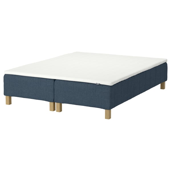 RENFJÄLLET bed base. White mattress, blue base with wooden legs. Upholstered, modern design.