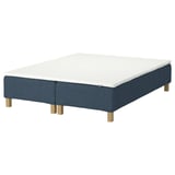 RENFJÄLLET bed base. White mattress, blue base with wooden legs. Upholstered, modern design.