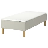 Image depicts an IKEA RENFJÄLLET mattress base with white upholstery and wooden legs.